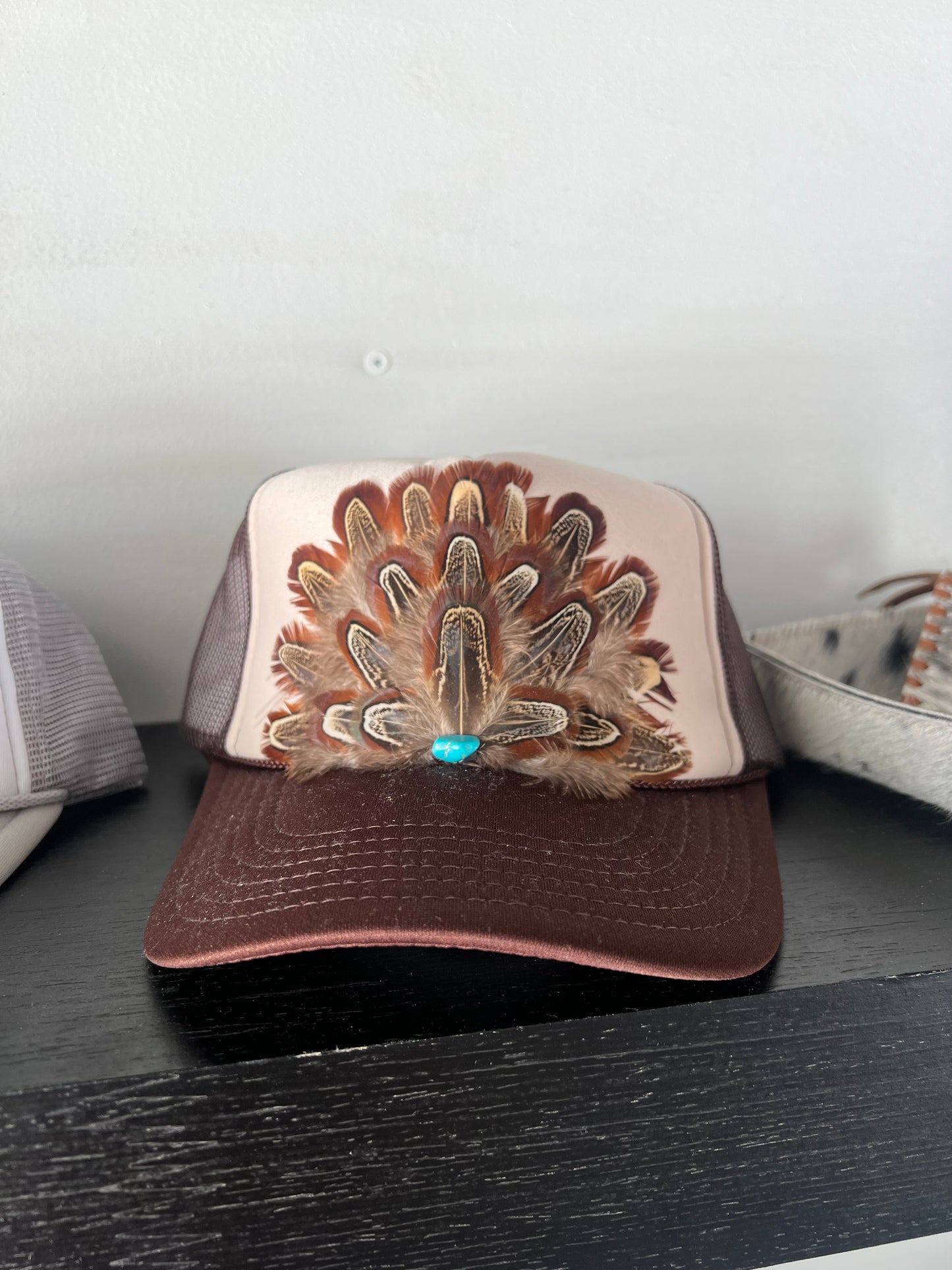 Feathered trucker hats